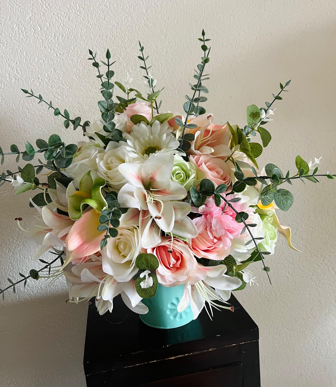 The hanging bucket with the wild flowers