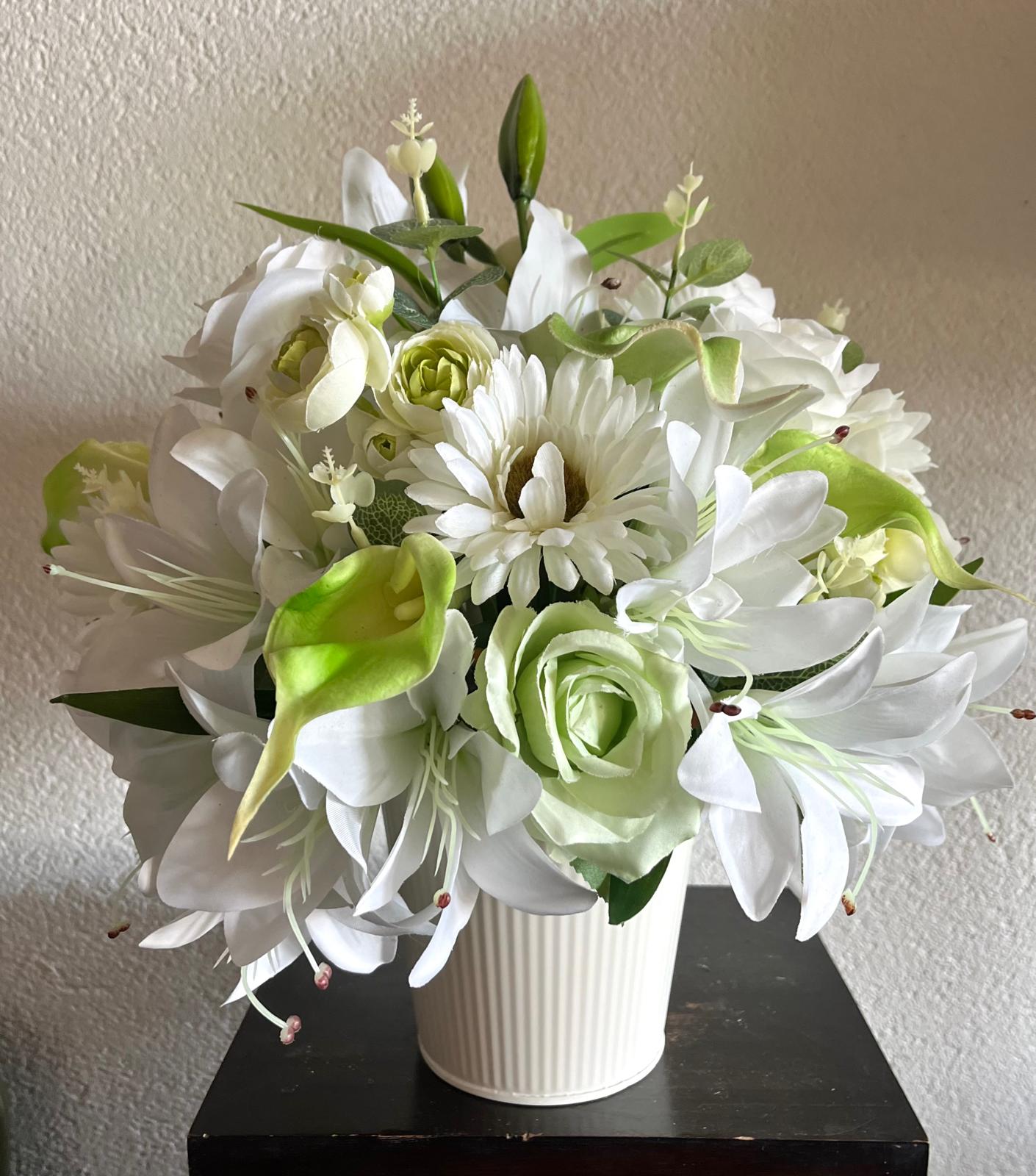 The hanging bucket with the white lilies
