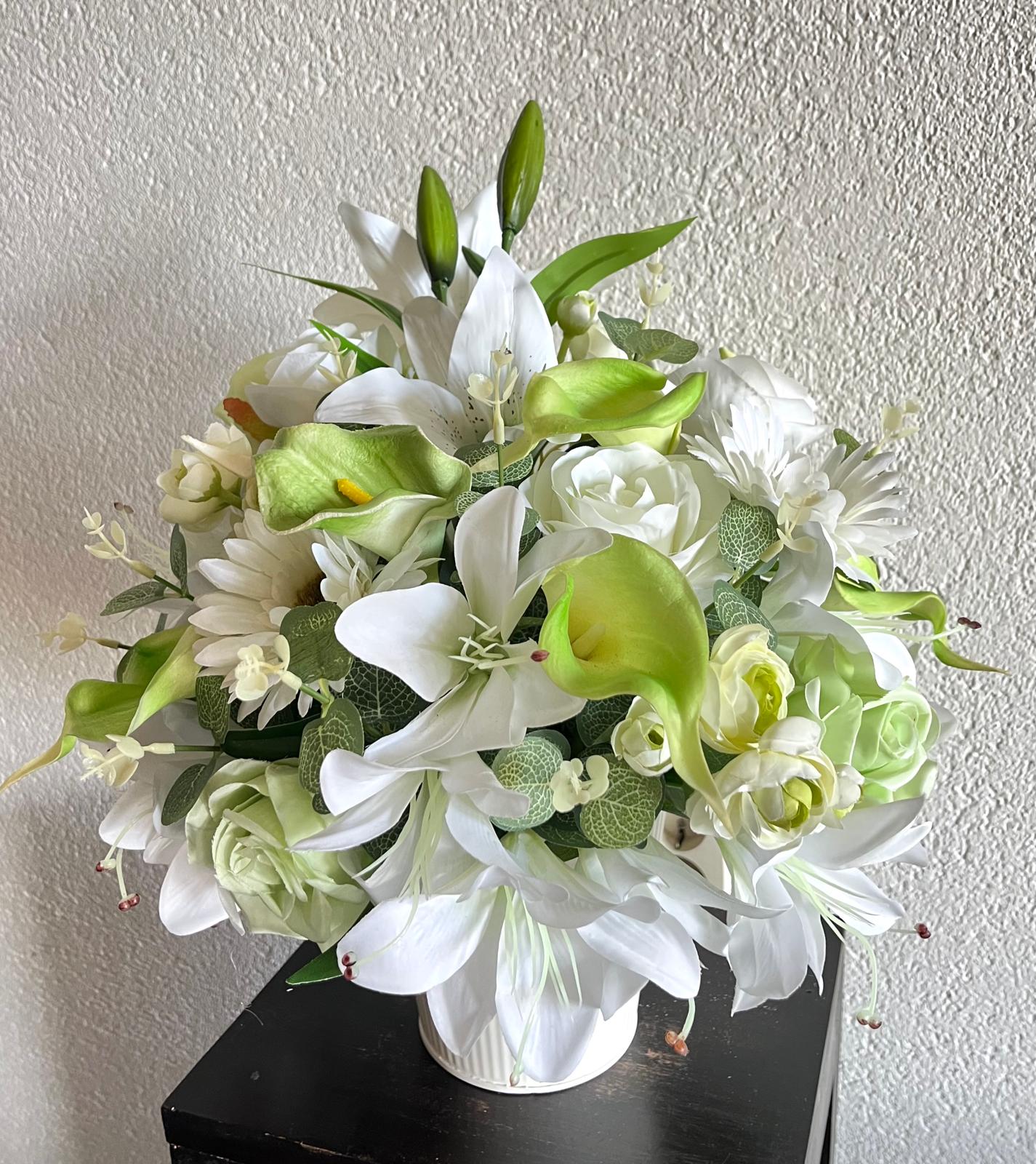 The hanging bucket with the white lilies