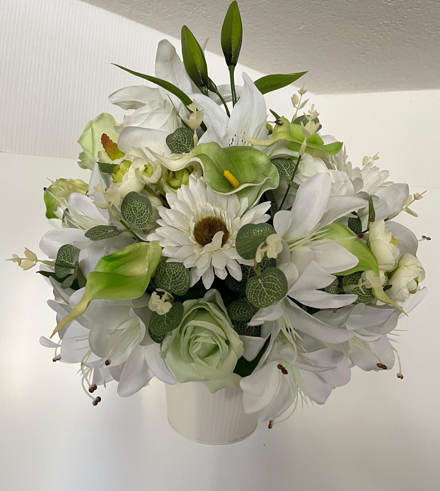 The hanging bucket with the white lilies