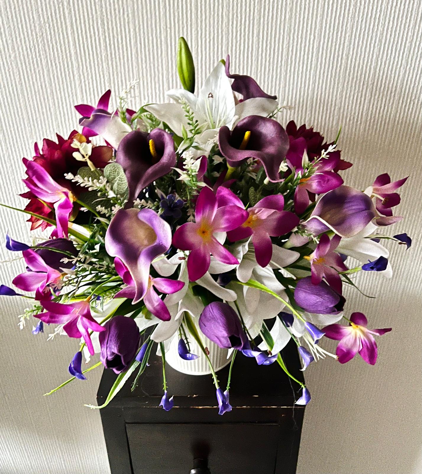 The hanging bucket with the purple lilies