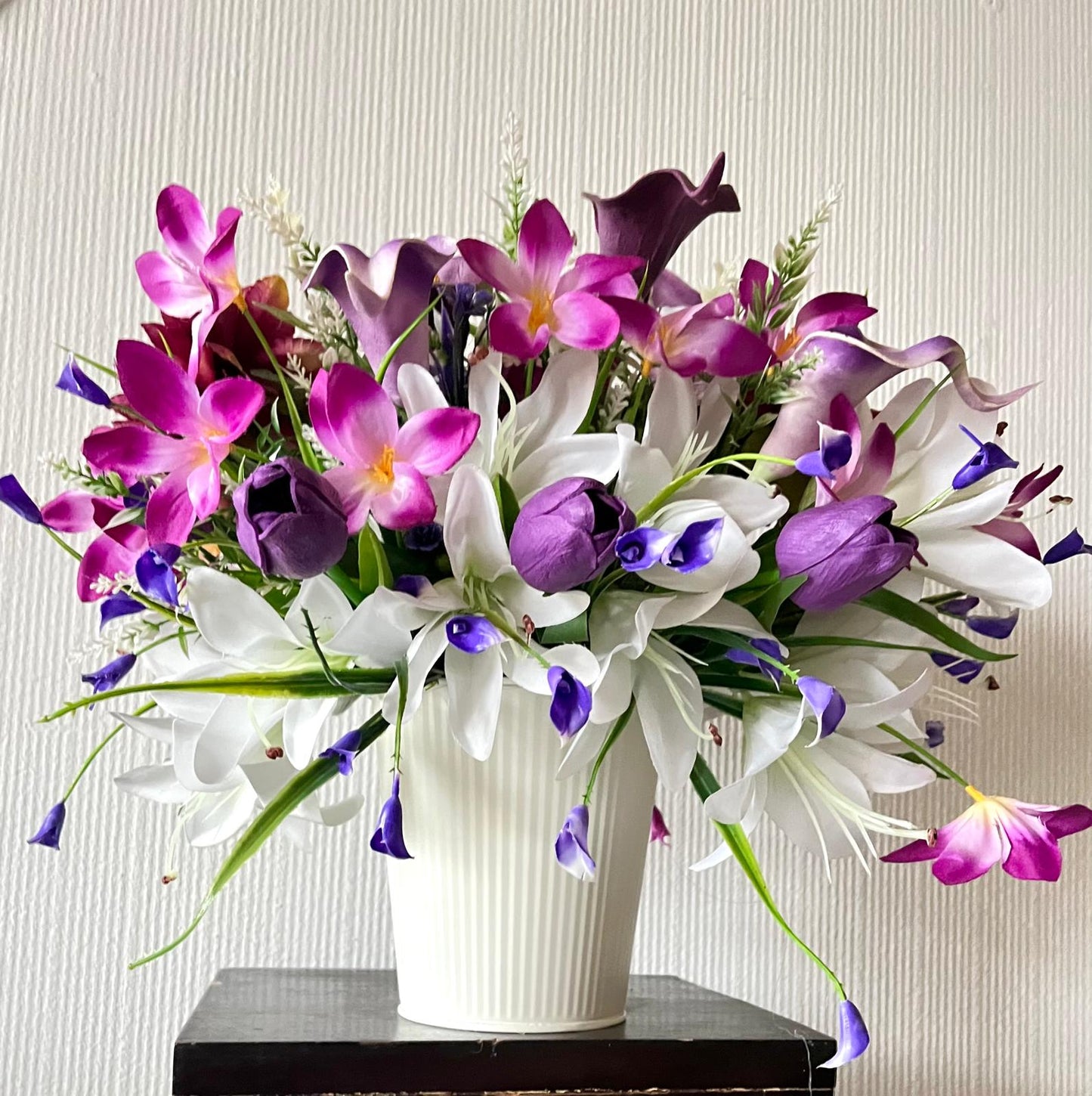 The hanging bucket with the purple lilies