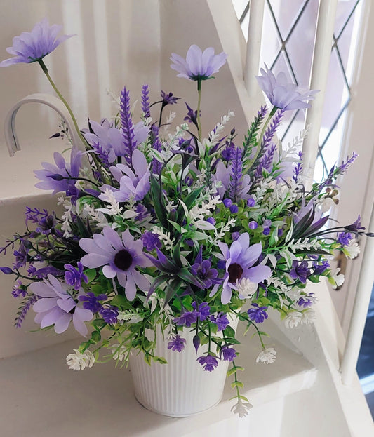 A bucket full of purple flowers