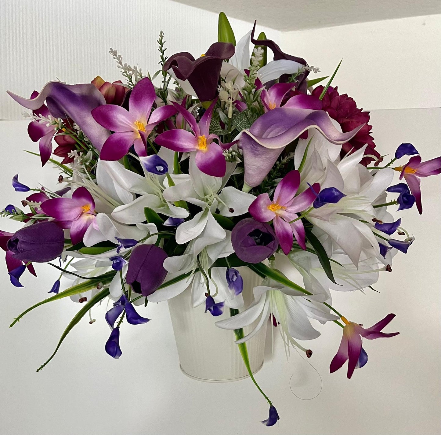 The hanging bucket with the purple lilies