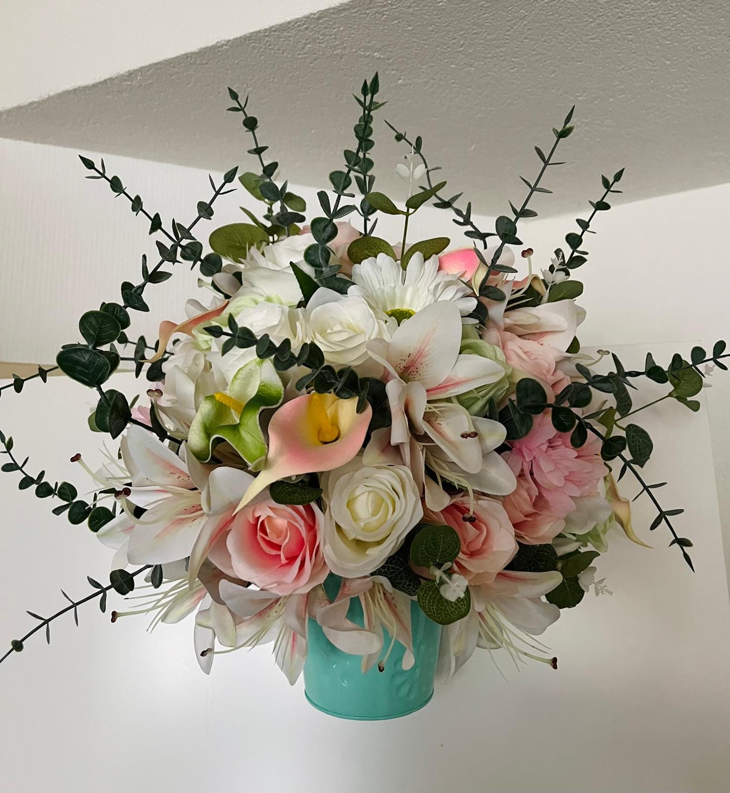 The hanging bucket with the wild flowers