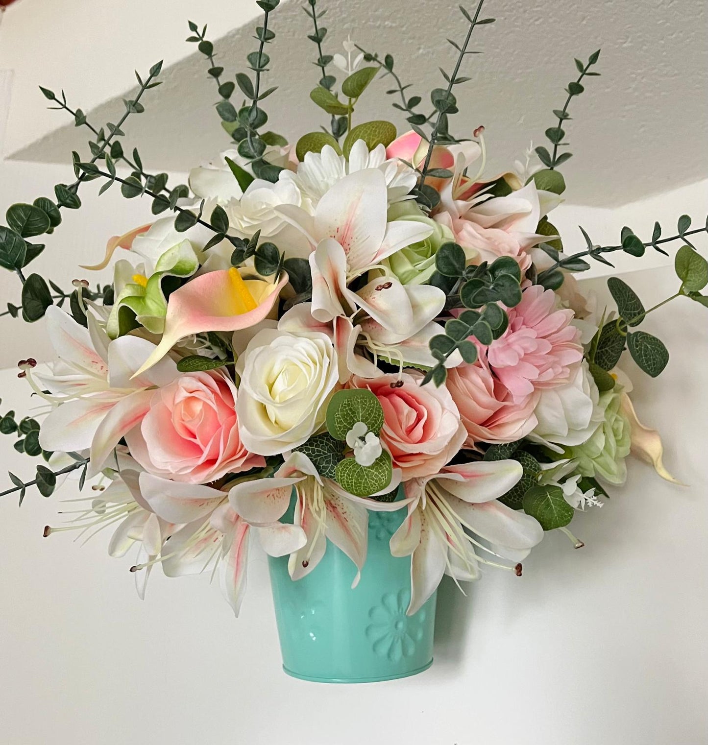 The hanging bucket with the wild flowers