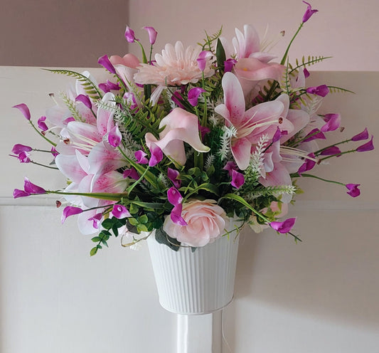 A bucket full of pink flowers